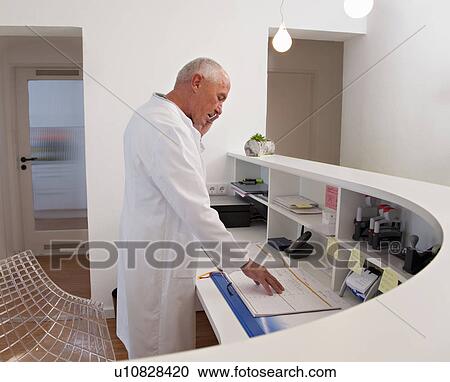 Stock Image - Doctor on the phone. Fotosearch