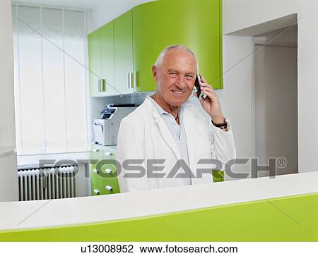 Stock Image - Doctor on the phone. Fotosearch