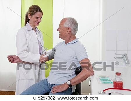 Doctor patient's taking blood pressure View Large Photo Image Stock Image - Doctor patient's taking blood pressure. Fotosearch