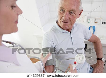 Doctor patient's taking blood pressure View Large Photo Image Stock Photo - Doctor patient's taking blood pressure. Fotosearch