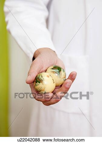 Doctor relaxing with massage balls View Large Photo Image Stock Photo - Doctor relaxing with massage balls. Fotosearch