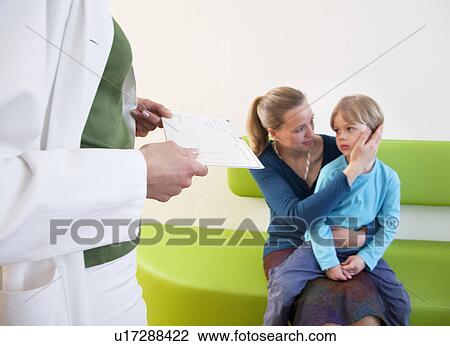 Doctor with patient in waiting area View Large Photo Image Stock Image - Doctor with patient in waiting area. Fotosearch