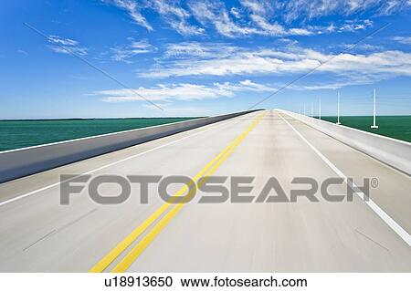 Stock Image - Empty road bridge (blurred motion). Fotosearch