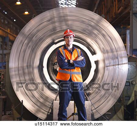 Stock Photo - Engineer In Front Of Steel Lathe. Fotosearch
