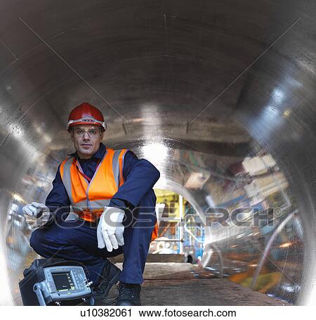 Engineer In Tunnel Of Forged Steel View Large Photo Image Stock Image - Engineer In Tunnel Of Forged Steel. Fotosearch
