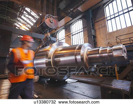 Stock Image - Engineer With Finished Steel Product. Fotosearch