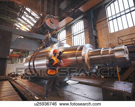 Stock Photograph - Engineer With Finished Steel Product. Fotosearch