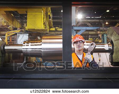 Picture - Engineer With Finished Steel Products. Fotosearch