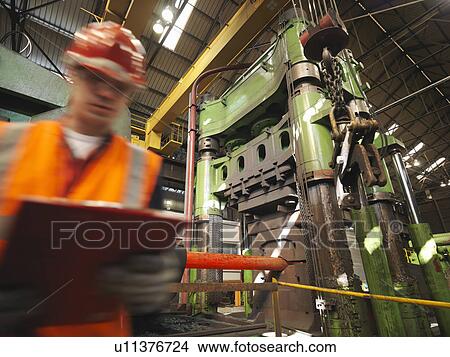 Picture - Engineer With Steel Forging Machine. Fotosearch