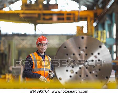Picture - Engineer Working With Steel Part. Fotosearch