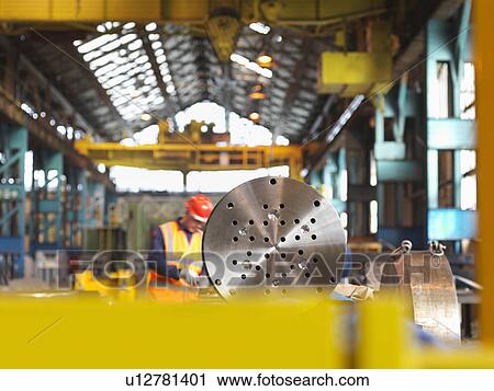Engineer Working With Steel Part View Large Photo Image Stock Image - Engineer Working With Steel Part. Fotosearch