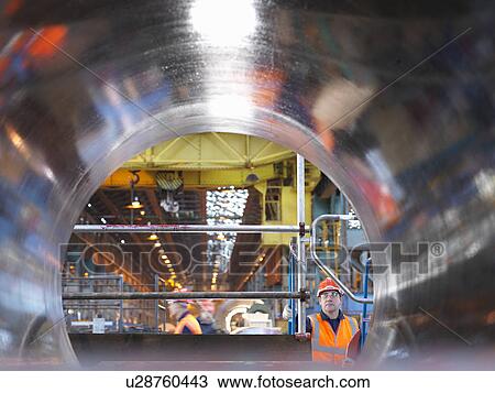 Stock Image - Engineers And Tunnel Of Forged Steel. Fotosearch