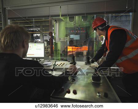 Stock Photograph - Engineers In Steel Forge Control Room. Fotosearch