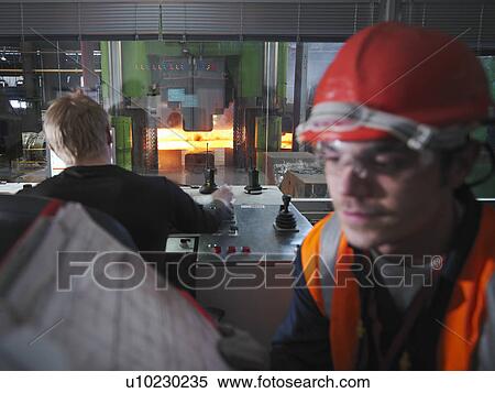 Stock Photography - Engineers In Steel Forge Control Room. Fotosearch