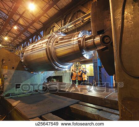 Stock Photo - Engineers Inspecting Forged Steel Roller. Fotosearch
