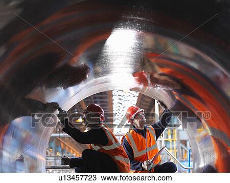 Stock Image - Engineers Testing Forged Steel. Fotosearch