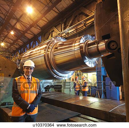 Picture - Engineers With Forged Steel Roller. Fotosearch