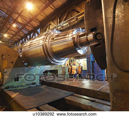 Stock Image - Engineers With Forged Steel Roller. Fotosearch