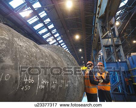 Stock Photo - Engineers With Forged Steel. Fotosearch