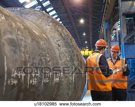 Stock Photography - Engineers With Forged Steel. Fotosearch