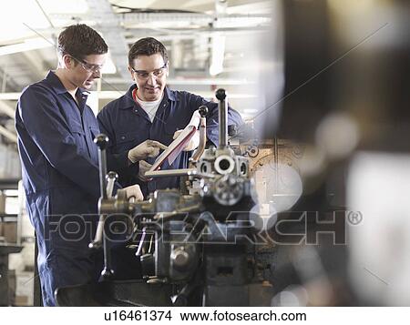 Experienced Engineer Teaching Apprentice View Large Photo Image Picture - Experienced Engineer Teaching Apprentice. Fotosearch