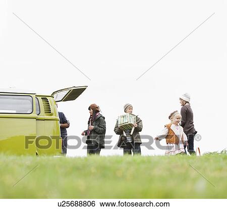 Family and camper van in open field View Large Photo Image Stock Photograph - Family and camper van in open field. Fotosearch