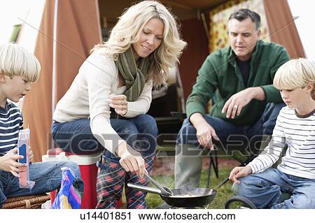 Family cooking meal outdoors View Large Photo Image Stock Image - Family cooking meal outdoors. Fotosearch