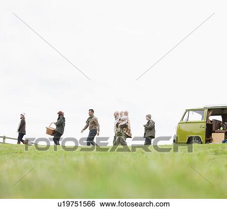 Stock Photograph - Family heading out for picnic. Fotosearch
