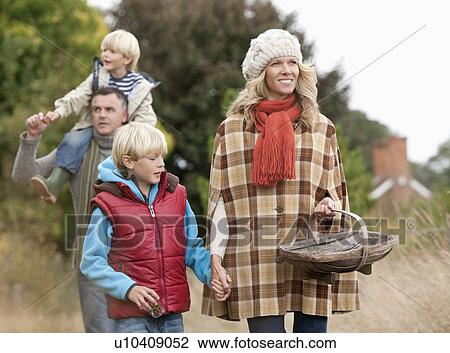 Family walking in nature View Large Photo Image Stock Image - Family walking in nature. Fotosearch
