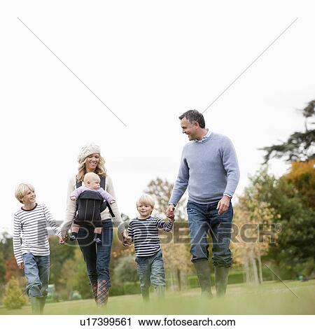 Family walking in nature View Large Photo Image Stock Image - Family walking in nature. Fotosearch
