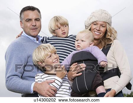 Stock Image - Family with baby outdoors. Fotosearch