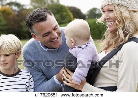 Family with baby outdoors View Large Photo Image Stock Image - Family with baby outdoors. Fotosearch