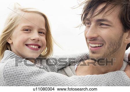 Picture - Father and daughter hugging. Fotosearch