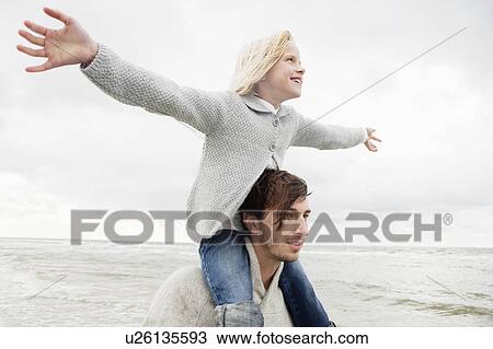 Father and daughter on beach View Large Photo Image Stock Image - Father and daughter on beach. Fotosearch