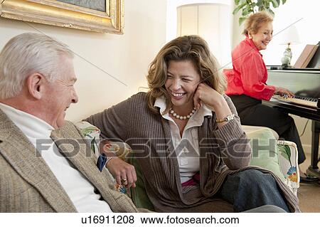 Father and daughter on couch talking View Large Photo Image Stock Photo - Father and daughter on couch talking. Fotosearch