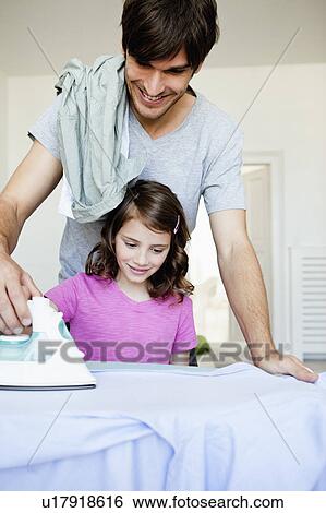 Father and girl ironing View Large Photo Image Stock Photograph - Father and girl ironing. Fotosearch