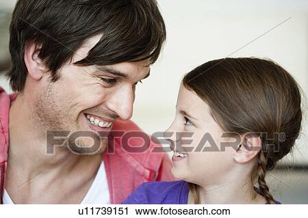 Father and girl looking to each other View Large Photo Image Stock Image - Father and girl looking to each other. Fotosearch