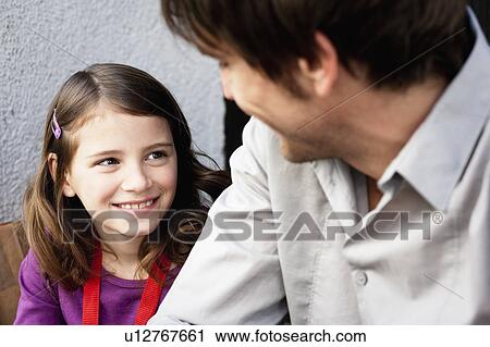 Father and girl looking to each other View Large Photo Image Stock Image - Father and girl looking to each other. Fotosearch