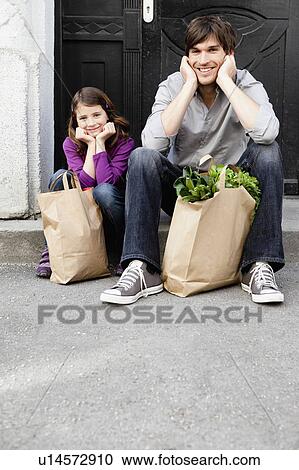 Stock Image - Father and girl shopping groceries. Fotosearch