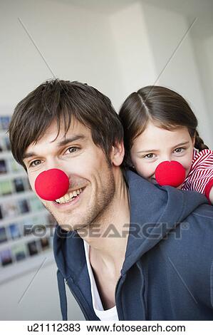 Father and girl with red noses View Large Photo Image Stock Image - Father and girl with red noses. Fotosearch