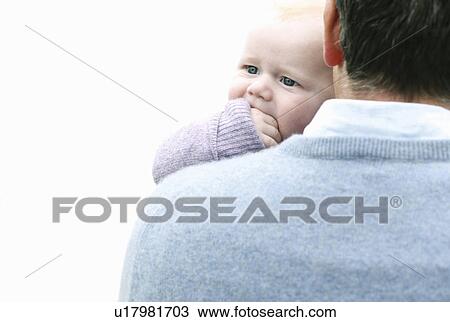 Father carrying infant son View Large Photo Image Stock Image - Father carrying infant son. Fotosearch