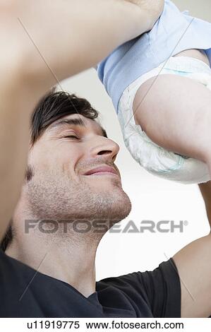 Father checking diaper View Large Photo Image Stock Photography - Father checking diaper. Fotosearch