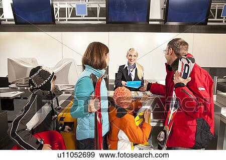 Father handing over vouchers for flight View Large Photo Image Stock Photo - Father handing over vouchers for flight. Fotosearch