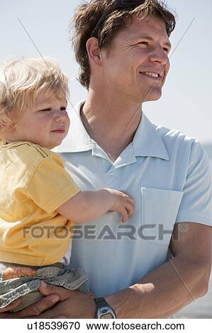Father holding son View Large Photo Image Stock Image - Father holding son. Fotosearch