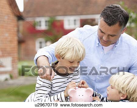 Stock Photo - Father teaching sons to save. Fotosearch
