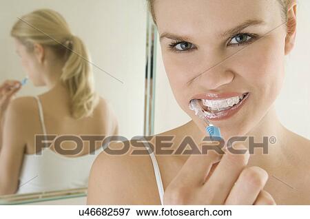 Female beauty brushing teeth View Large Photo Image Stock Photo - Female beauty brushing teeth. Fotosearch