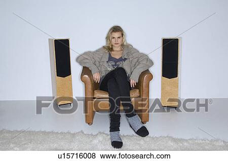 Stock Photo - Female beauty listening to music. Fotosearch
