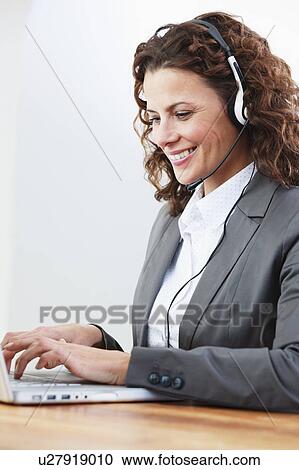 female call center agent typing View Large Photo Image Stock Image - female call center agent typing. Fotosearch