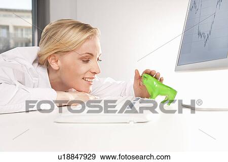 Female stroking a green bull in office View Large Photo Image Stock Photo - Female stroking a green bull in office. Fotosearch