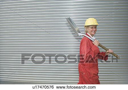 Stock Photograph - Female surveying countryside. Fotosearch